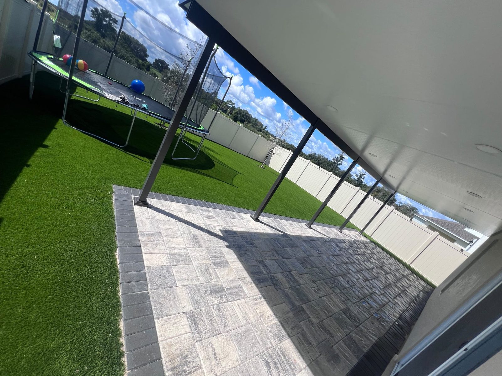 Paver Patio, Screened Lanai and Artificial Turf