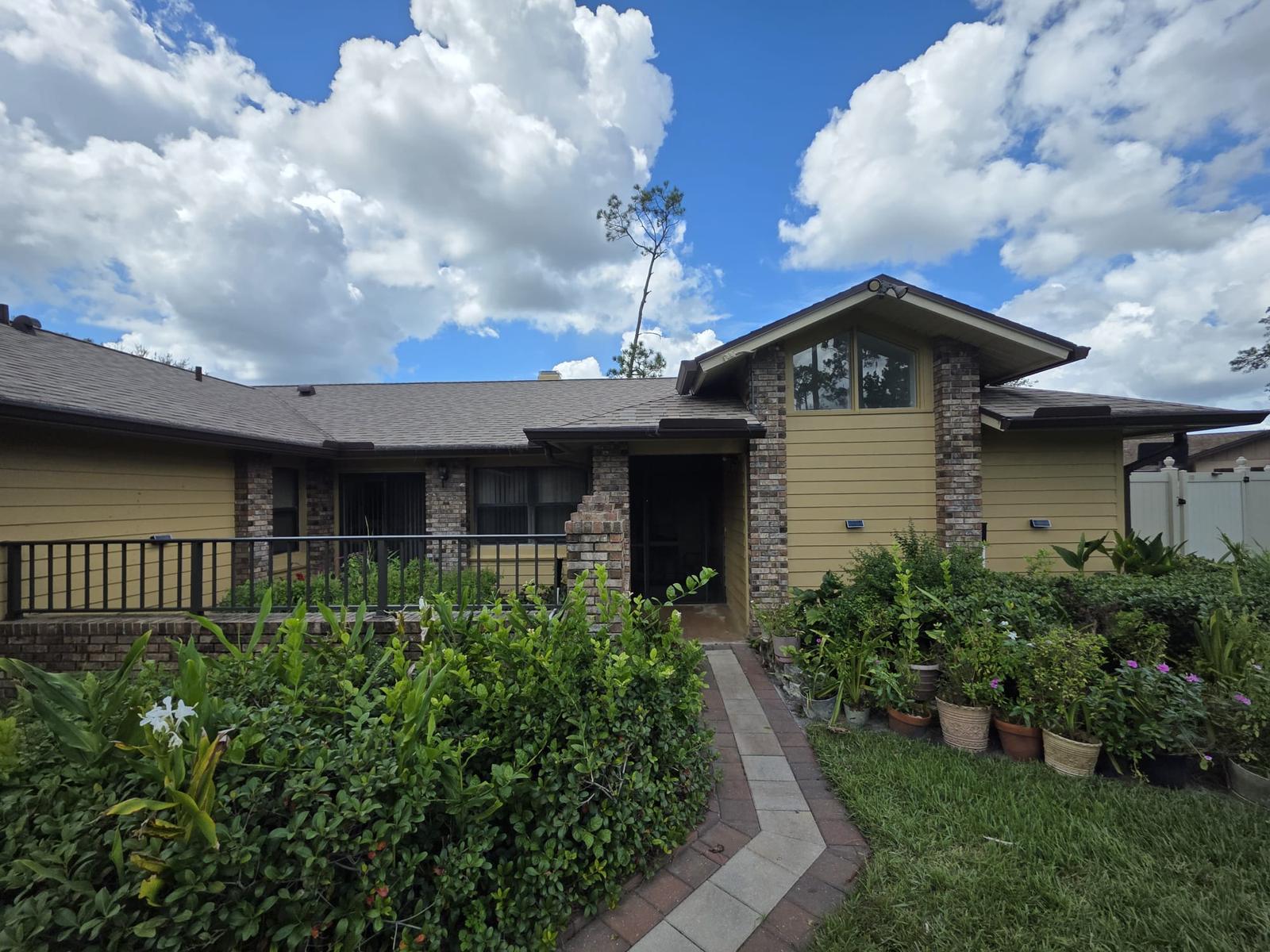 Exterior Repaint, Stucco Repairs and Siding Replacement